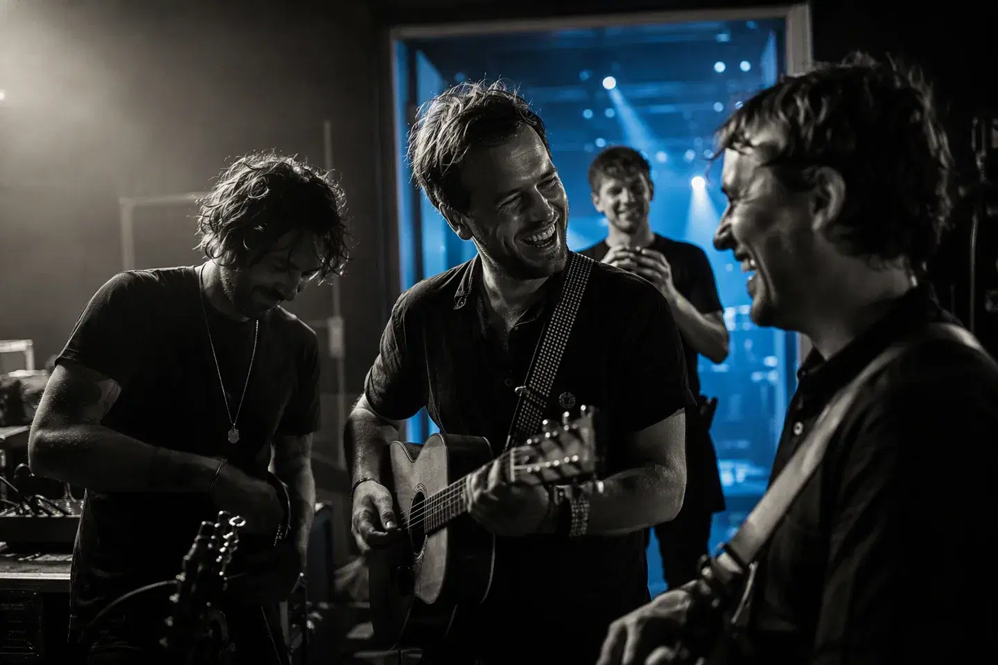 Musicians sharing a laugh together backstage